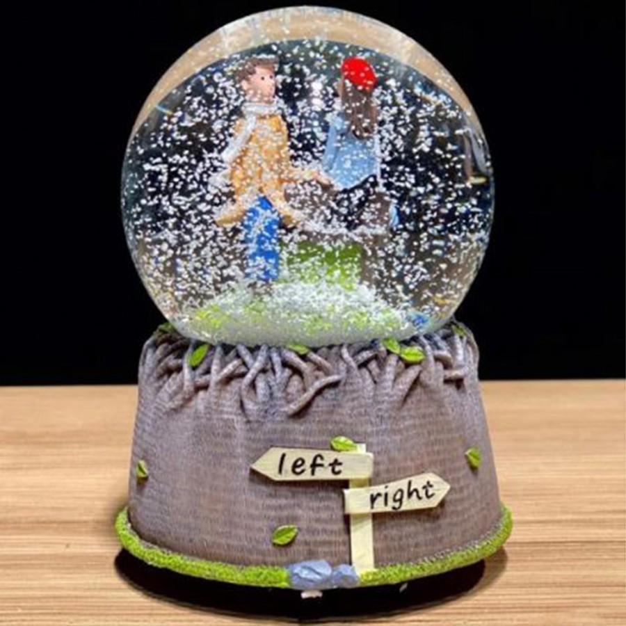 Musical snow globe couple in love