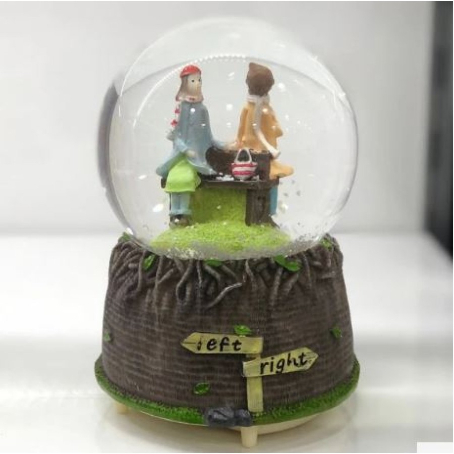 Musical snow globe couple in love