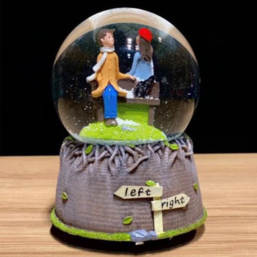 Musical snow globe couple in love